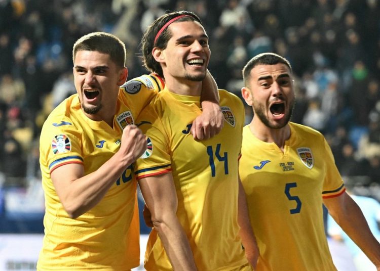 Romania's midfielder #14 Ianis Hagi (C) celebrates with teammates scoring during the UEFA Euro 2024 group I qualification football match between Israel and Romania in Felcsut on November 18, 2023.,Image: 822933692, License: Rights-managed, Restrictions: , Model Release: no